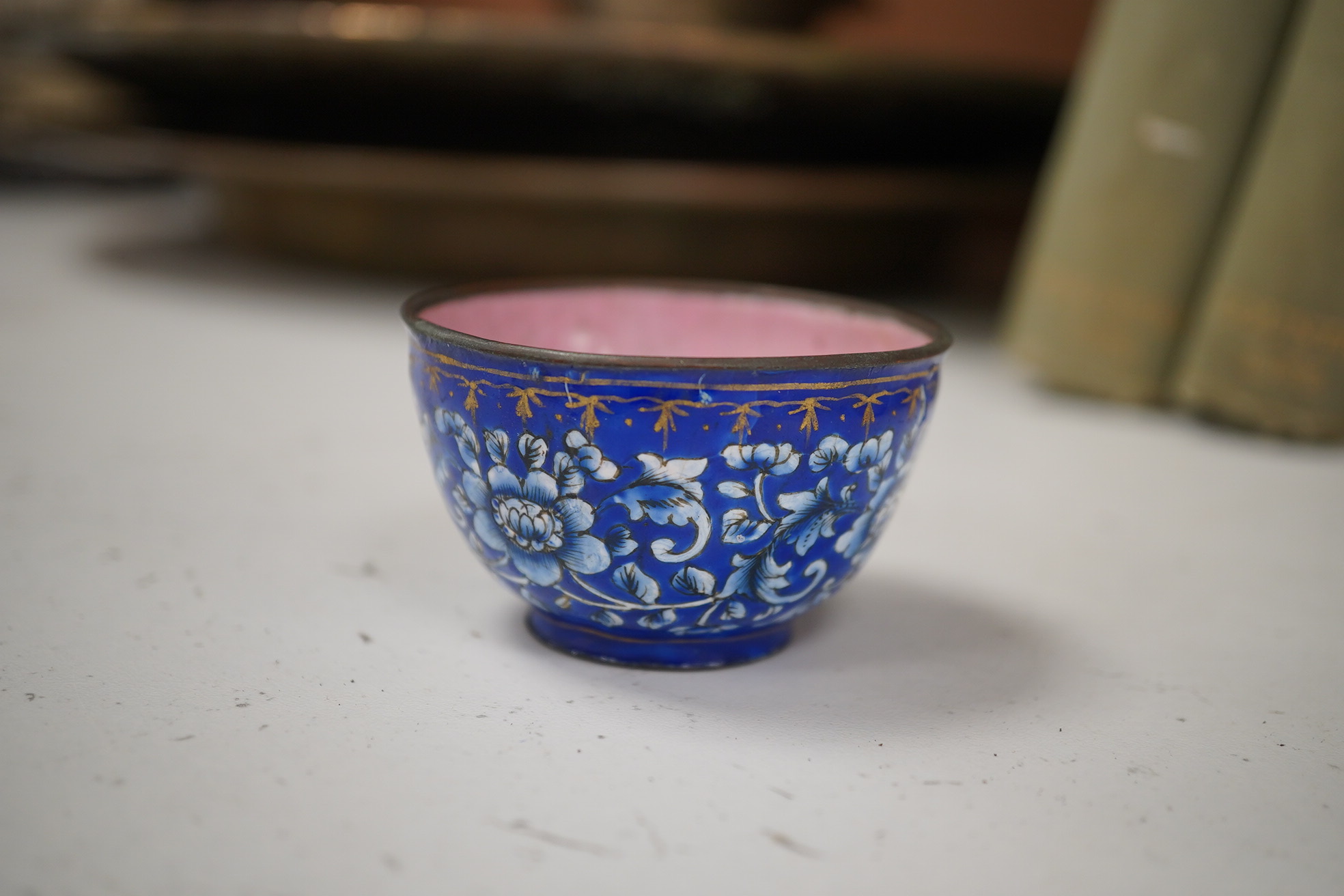 A group of Chinese blue and white porcelain, including a mid 19th century Canton enamel teabowl and a Japanese small dish, tallest 22cm. Condition - fair